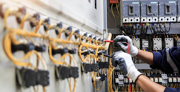Professional Electrician technician working in Ames, IA